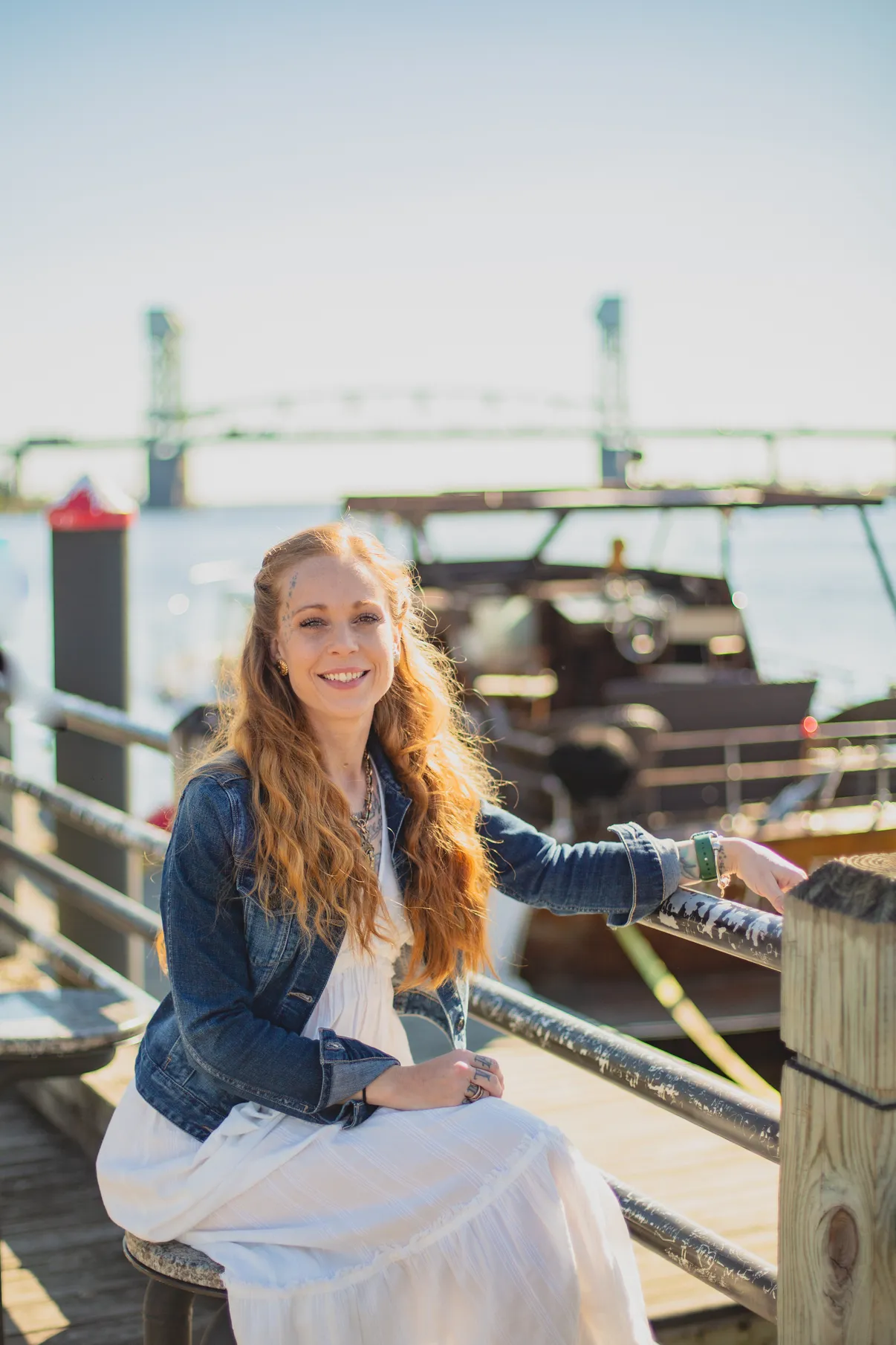 Portrait of Holly, founder of Something Blue Wedding Design, on the Wilmington waterfront