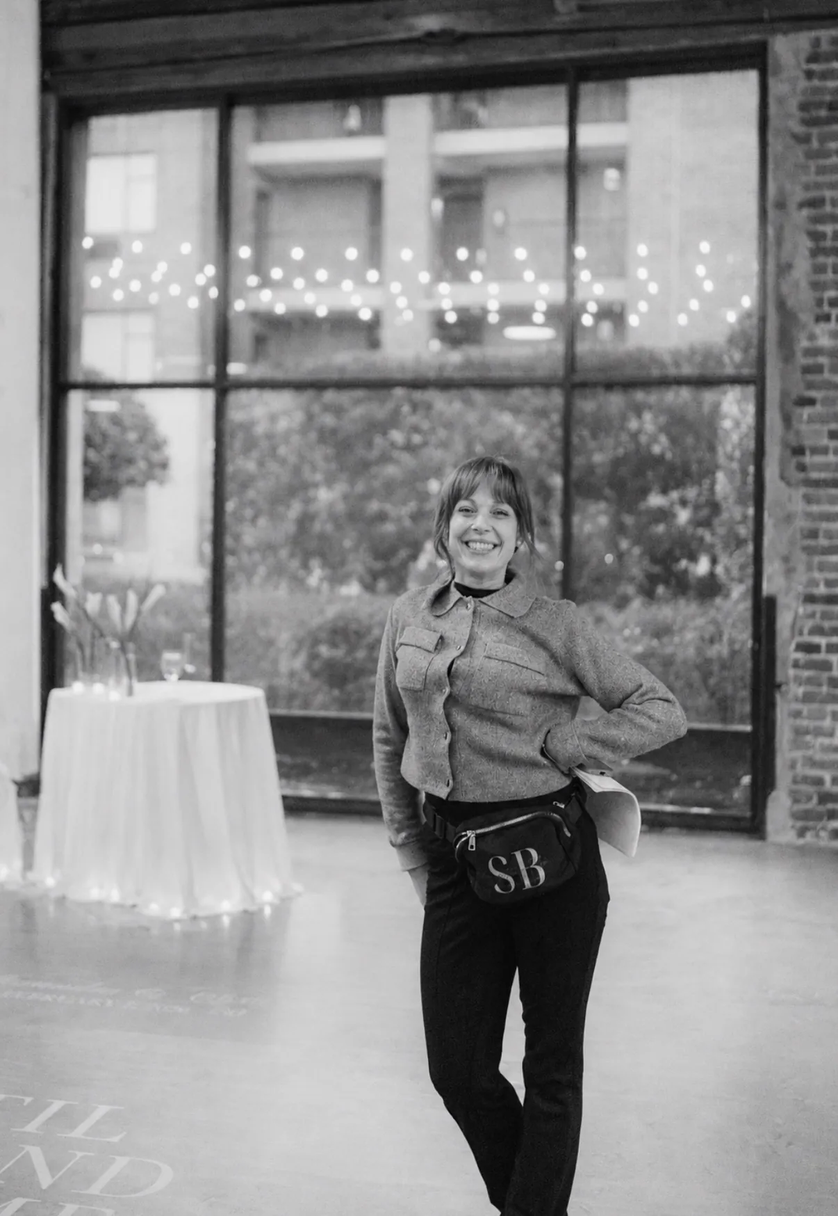 Portrait of Holly, founder of Something Blue Wedding Design, smiling in a venue